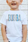 A child wearing a white short-sleeved t-shirt with the text 'BUBBA' printed in blue camo colorblock style on the front.