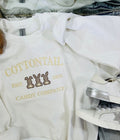 White sweatshirt with 'Cottontail Candy Co. est.