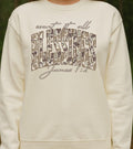 White sweatshirt with Count it all blessings james 1:2 text camo design against a natural background