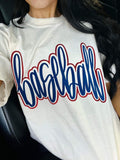 White t-shirt with 'baseball' printed in blue puff vinyl and red glitter on a person sitting in a car.