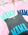 Three tank tops with 'MAMA' text in different colors on a pink background.