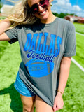Woman wearing a gray 'Dallas Football' t-shirt on a grassy field