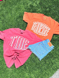 Two t-shirts with 'TIDE' and 'TENNESSEE' text on grass